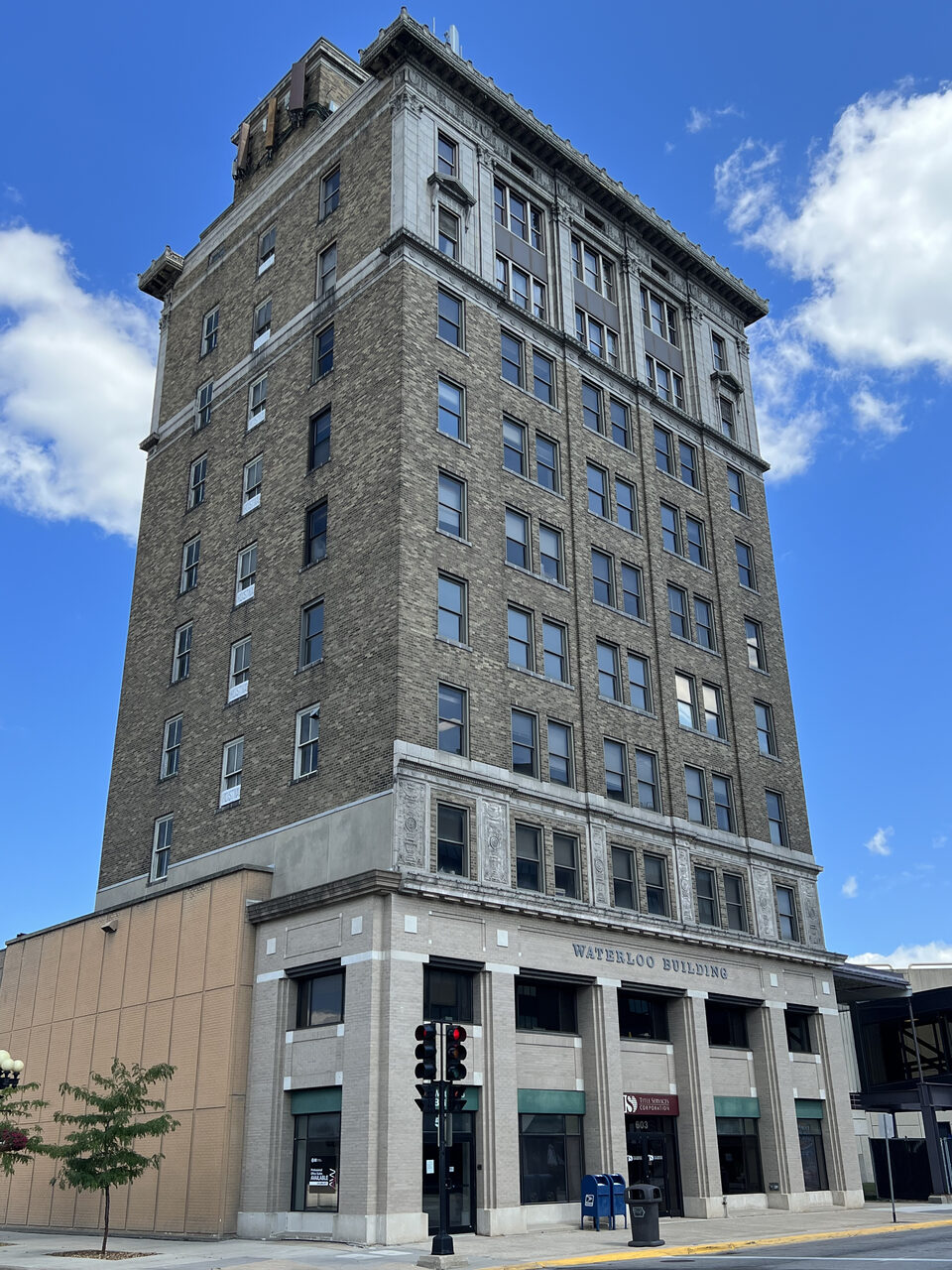 The ten-story Waterloo Building rising against a blue sky at 531 Commercial Street, Waterloo, Iowa